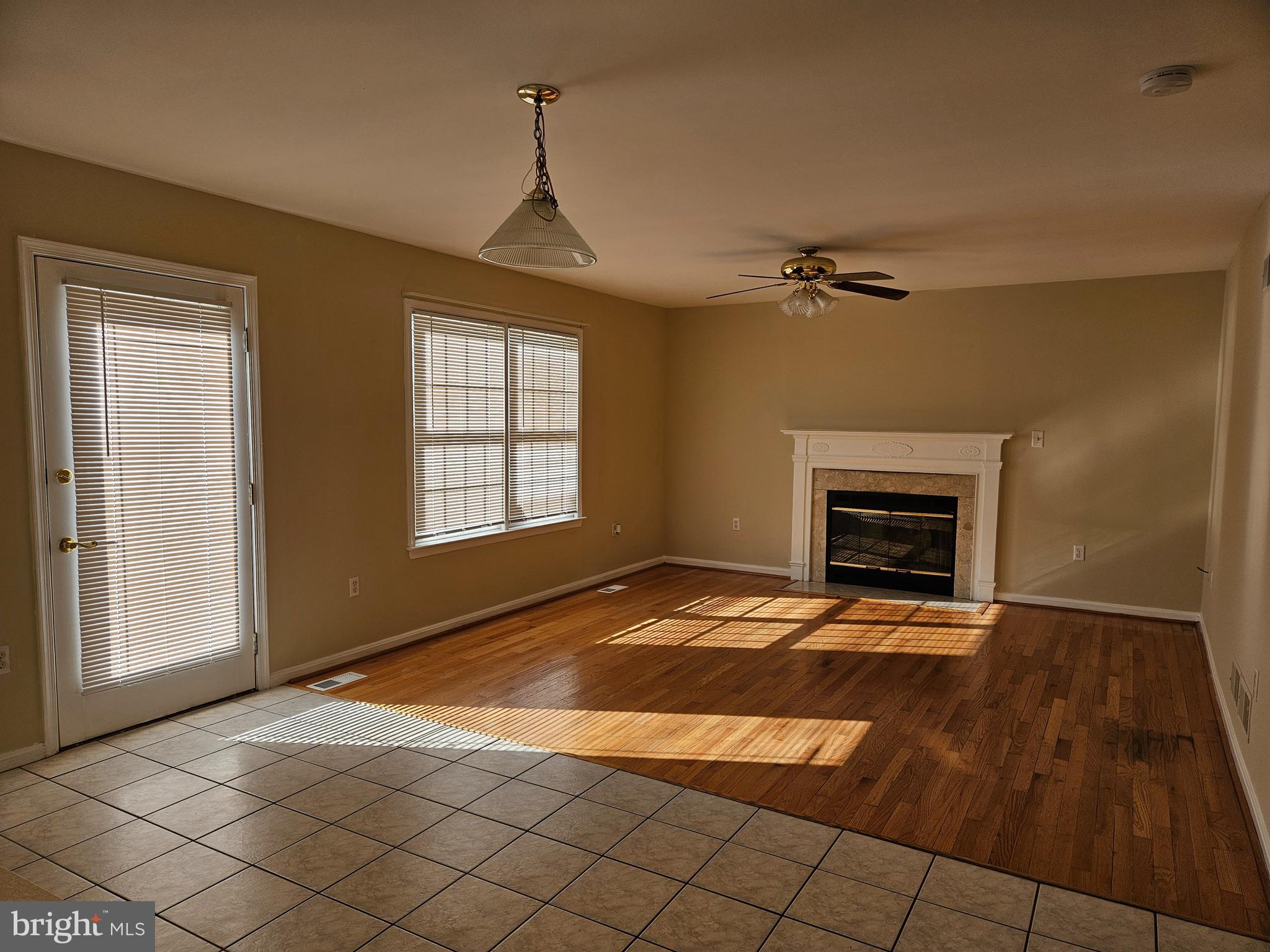 108 Finch Lane Falling Waters, WV 25419 - Photo 13 of 33 a view of an empty room with a fireplace and a window