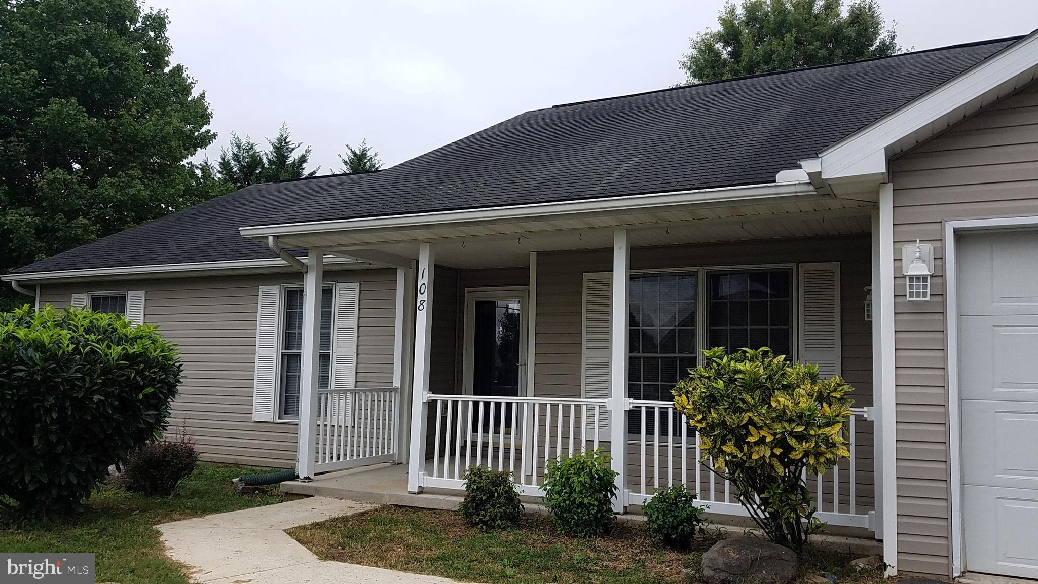 108 Finch Lane Falling Waters, WV 25419 - Photo 3 of 33 a front view of a house with a garden