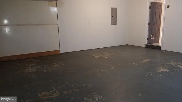 a view of a stadium that has a street sign on the side of it