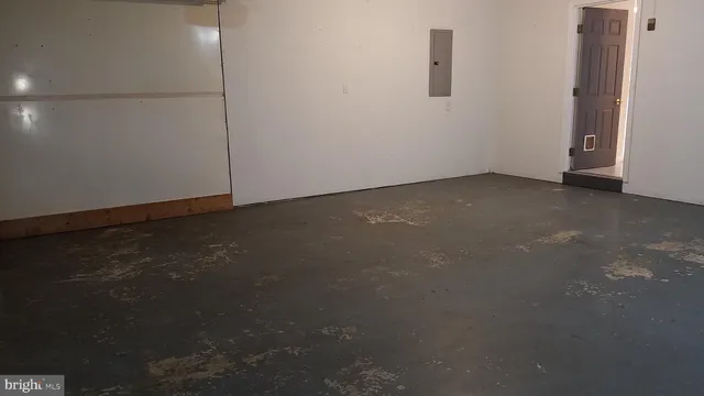 a view of a stadium that has a street sign on the side of it