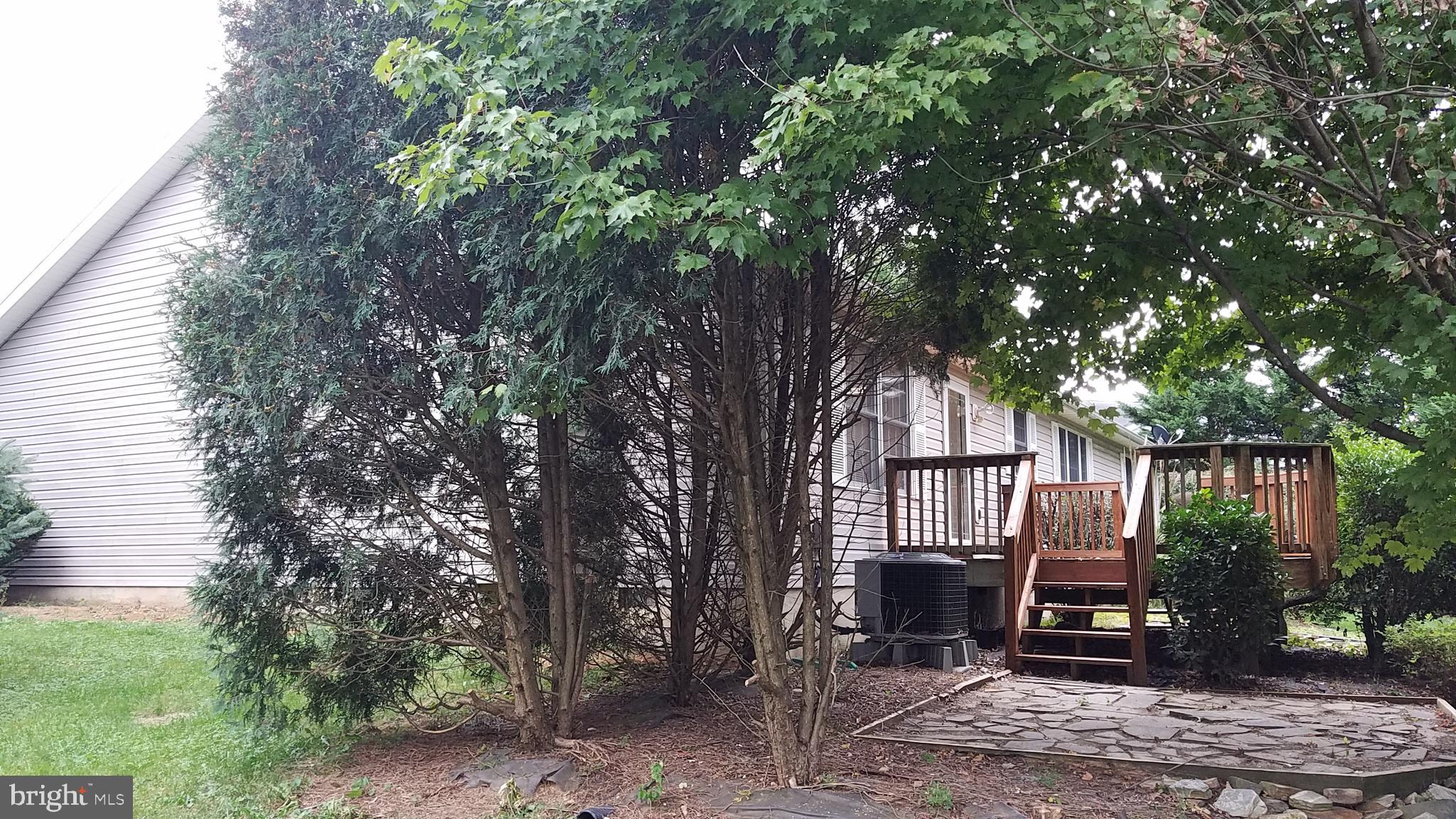 108 Finch Lane Falling Waters, WV 25419 - Photo 5 of 33 a front view of a house with a garden