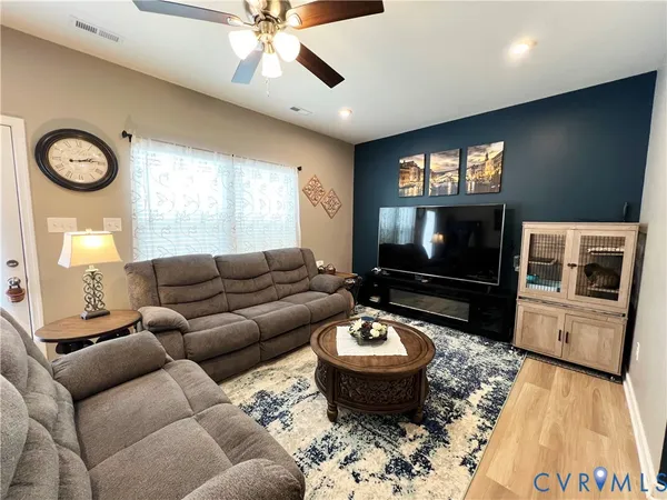 a bathroom with a sink mirror and toilet