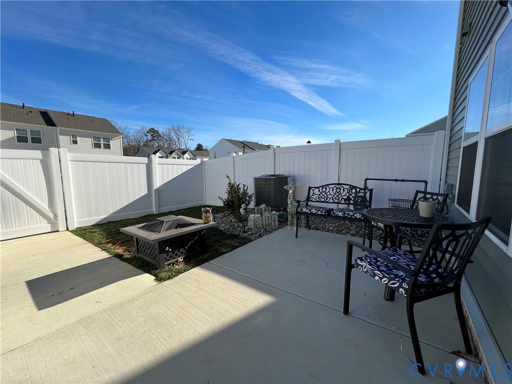 223 Whiteside Road Sandston, VA 23150 - Photo 11 of 12 Fenced backyard with a patio area and an outdoor f