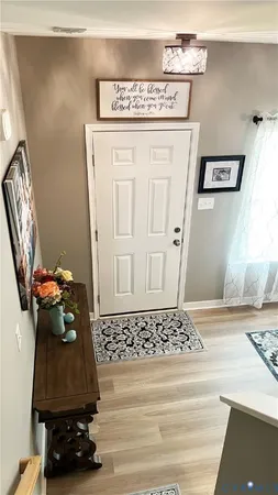 a bed room with a bed and a chandelier