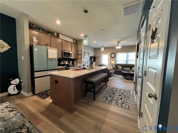 a kitchen with a sink and refrigerator