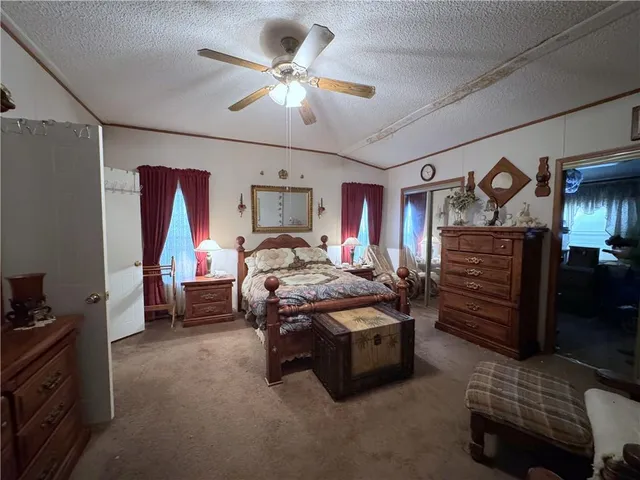 a bed room with furniture and a chandelier