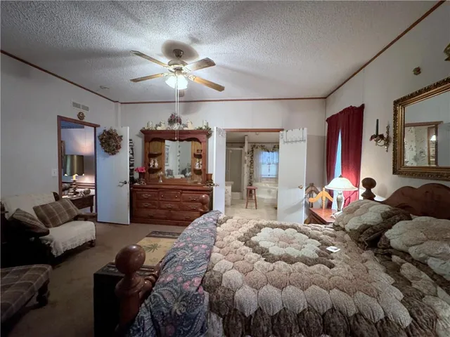 a spacious bathroom with a double vanity sink toilet mirror and shower