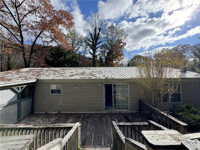 a view of a yard with large tree