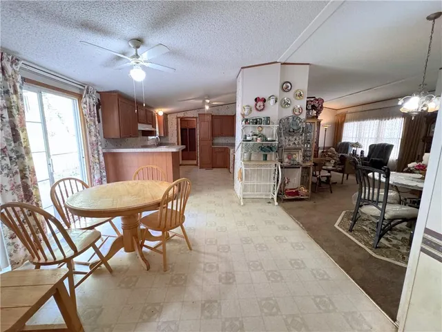 a dining room with furniture and chandelier