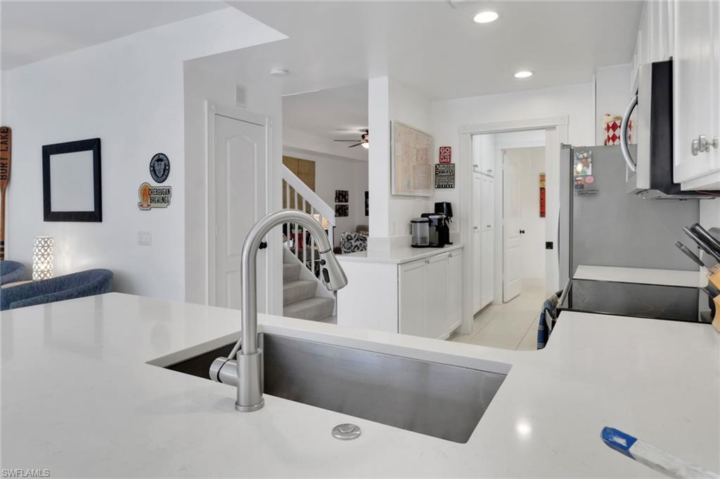 3570 Zanzibar Way Naples, FL 34119 - Photo 13 of 43 a living room with furniture and a flat screen tv