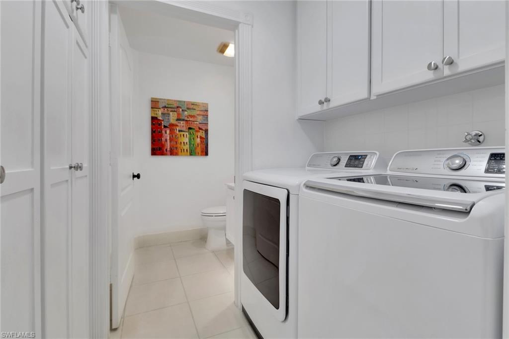 3570 Zanzibar Way Naples, FL 34119 - Photo 23 of 43 a utility room with dryer and washer