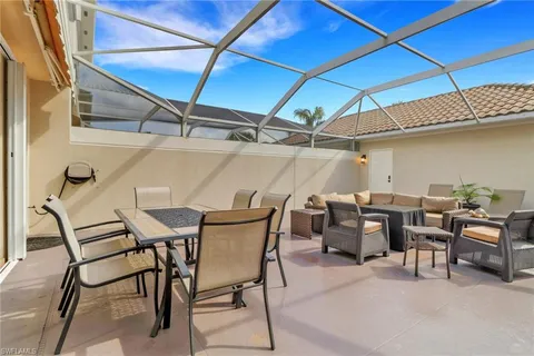 a view of an outdoor space with a table and chairs