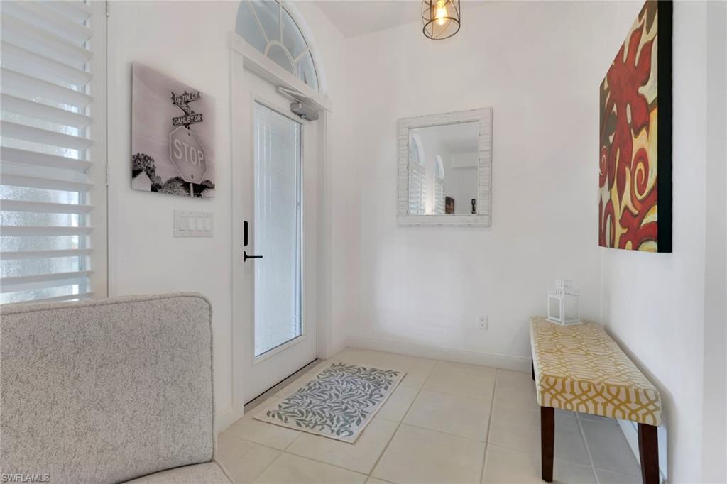 3570 Zanzibar Way Naples, FL 34119 - Photo 4 of 43 a bathroom with a tub and shower