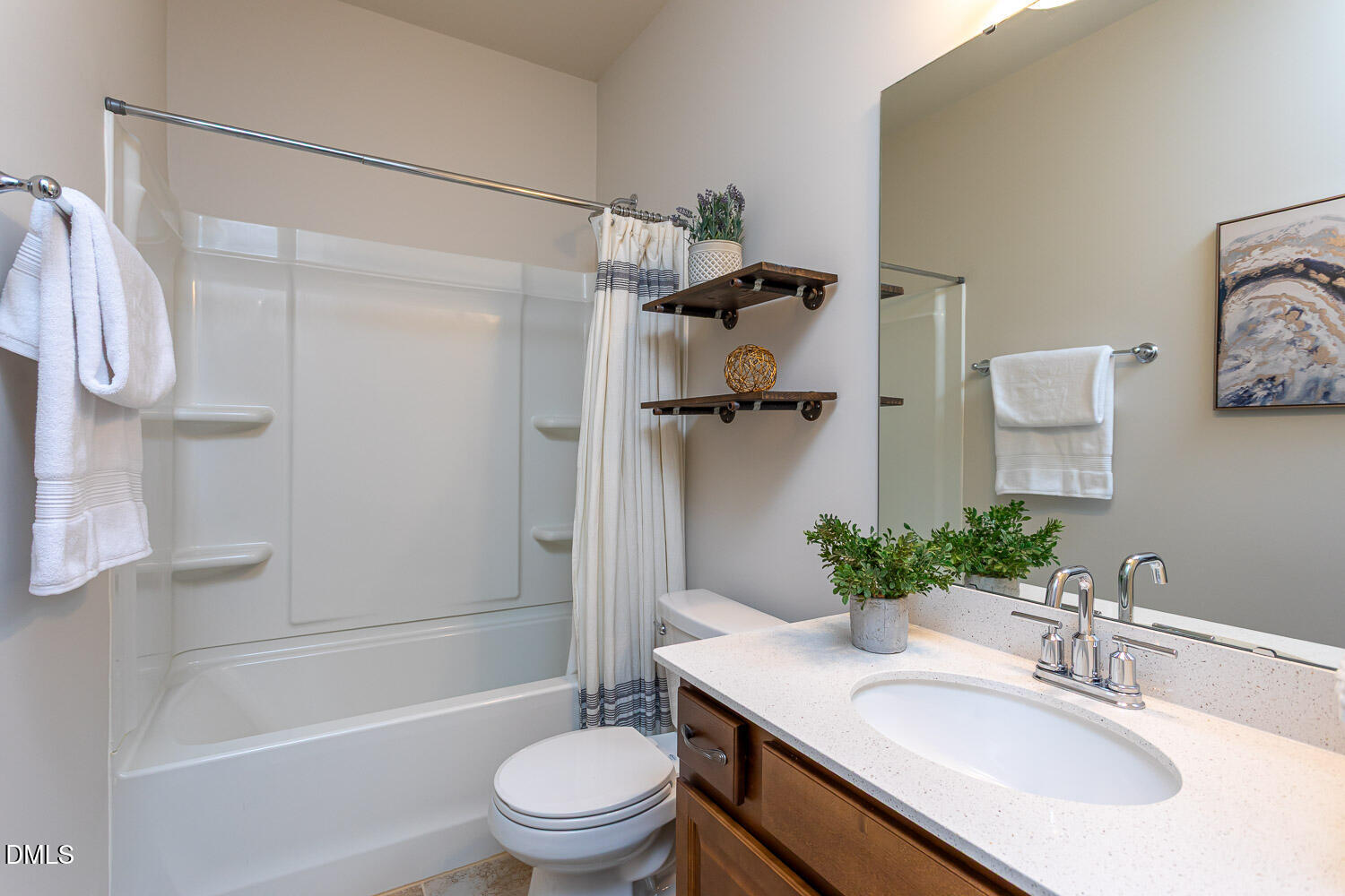 6197 Beale Loop Raleigh, NC 27616 - Photo 13 of 20 a bathroom with a sink toilet and shower