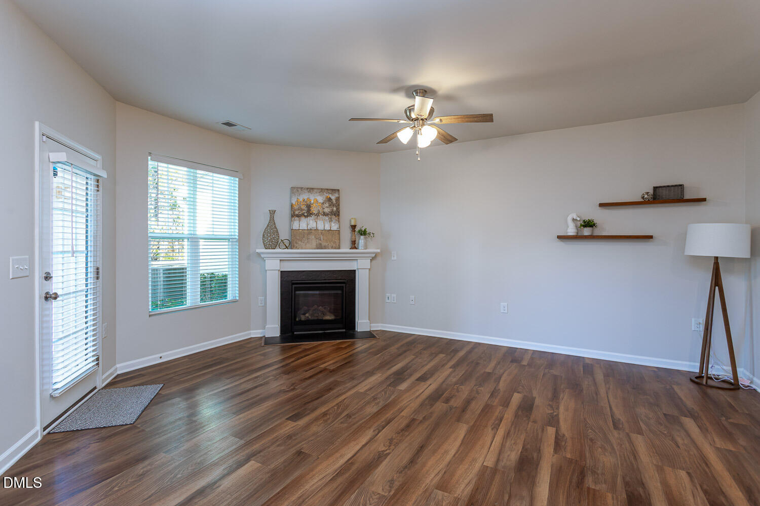 6197 Beale Loop Raleigh, NC 27616 - Photo 6 of 20 a view of empty room with wooden floor and fan