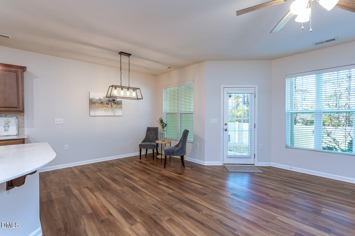 6197 Beale Loop Raleigh, NC 27616 - Photo 7 of 20 a view of a dining room with furniture window and wooden floor
