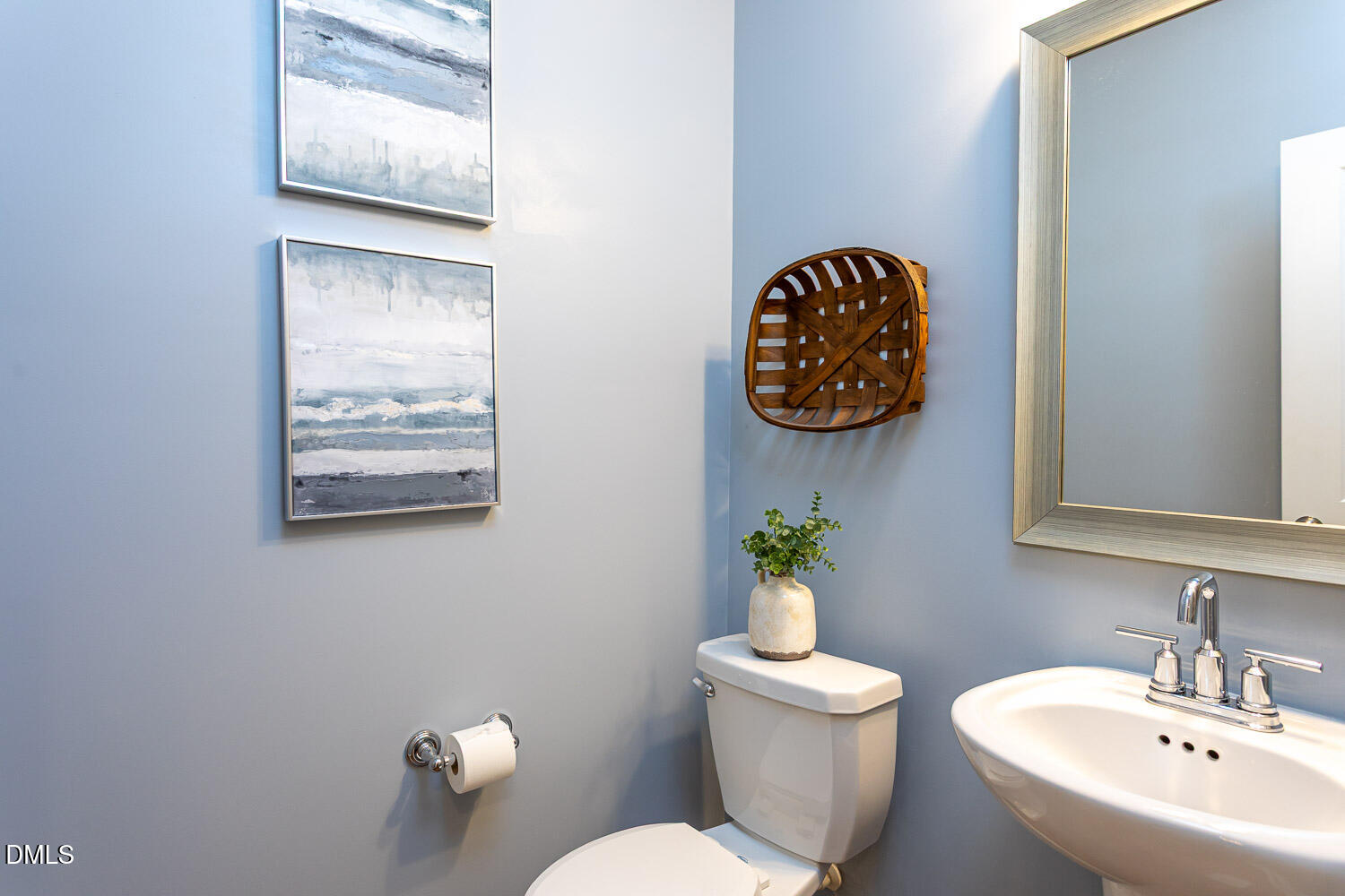 6197 Beale Loop Raleigh, NC 27616 - Photo 8 of 20 a bathroom with a toilet a sink and mirror