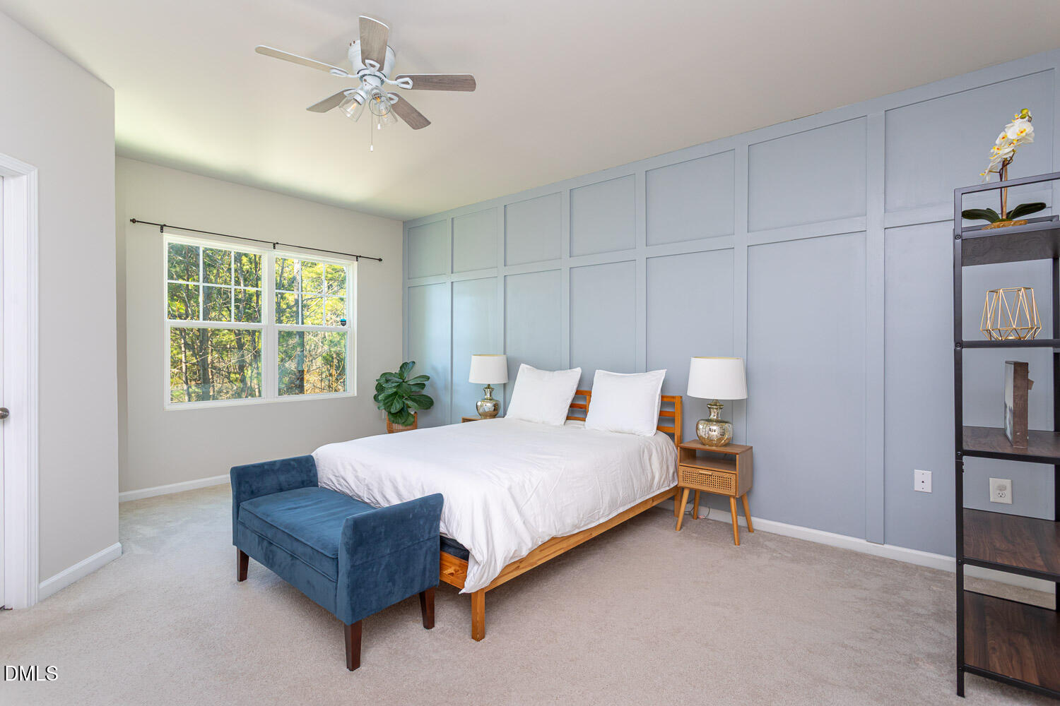 6197 Beale Loop Raleigh, NC 27616 - Photo 9 of 20 a bedroom with a bed and a chandelier