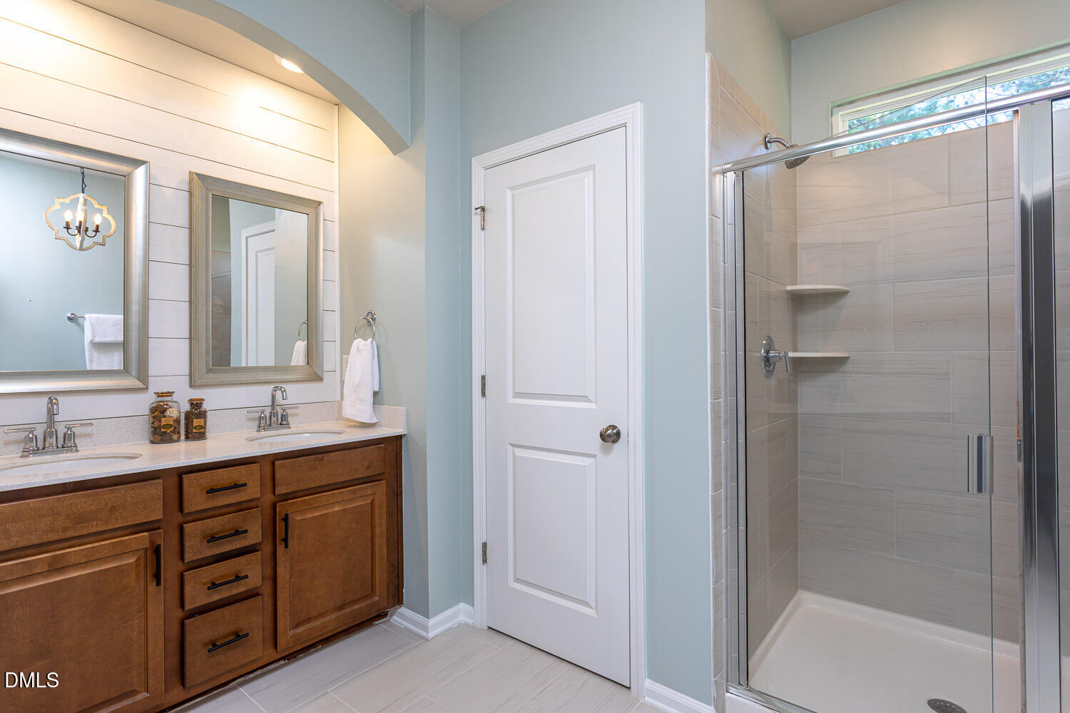 6197 Beale Loop Raleigh, NC 27616 - Photo 10 of 20 a bathroom with a double vanity sink a toilet and shower