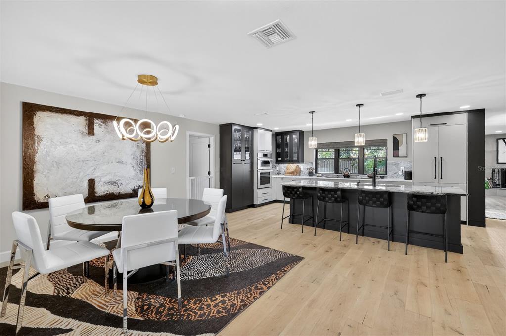 241 Bay Road Mount Dora, FL 32757 - Photo 11 of 57 a large kitchen with a table and chairs