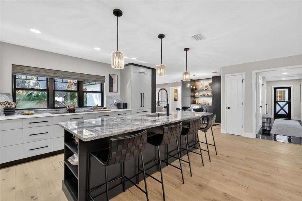 241 Bay Road Mount Dora, FL 32757 - Photo 14 of 57 a kitchen with stainless steel appliances granite countertop a kitchen island a stove and a wooden floors