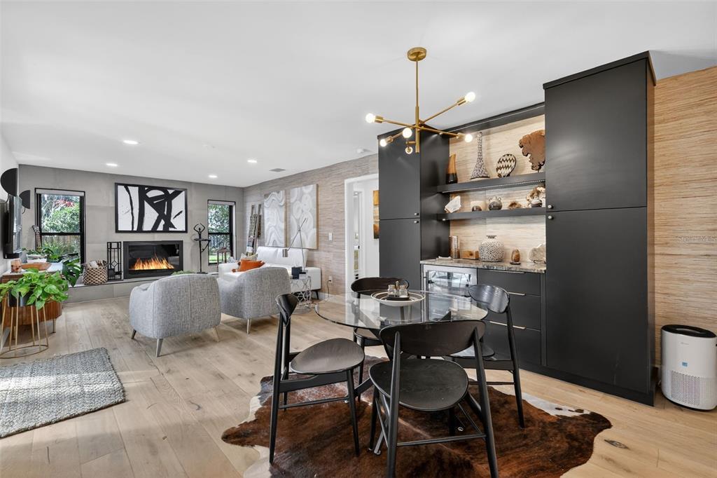 241 Bay Road Mount Dora, FL 32757 - Photo 22 of 57 a living room with furniture kitchen view and a wooden floor