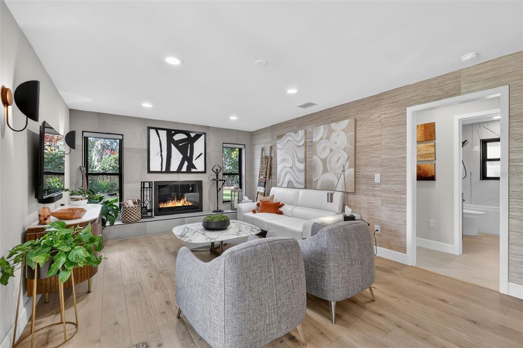 241 Bay Road Mount Dora, FL 32757 - Photo 23 of 57 a living room with furniture fireplace and a large window
