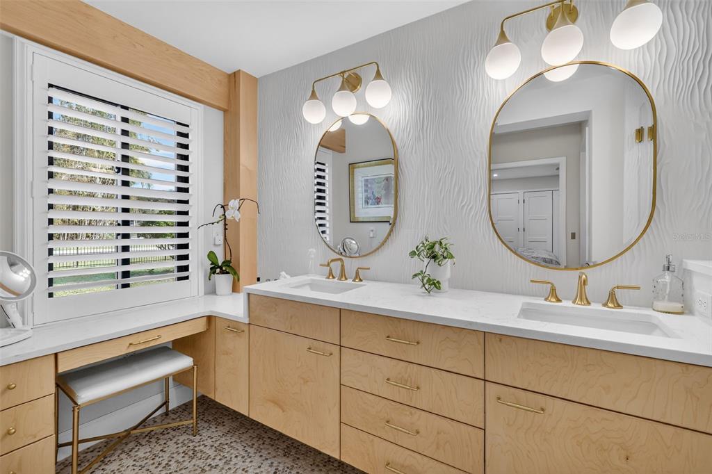 241 Bay Road Mount Dora, FL 32757 - Photo 29 of 57 a bathroom with a double vanity sink and a mirror
