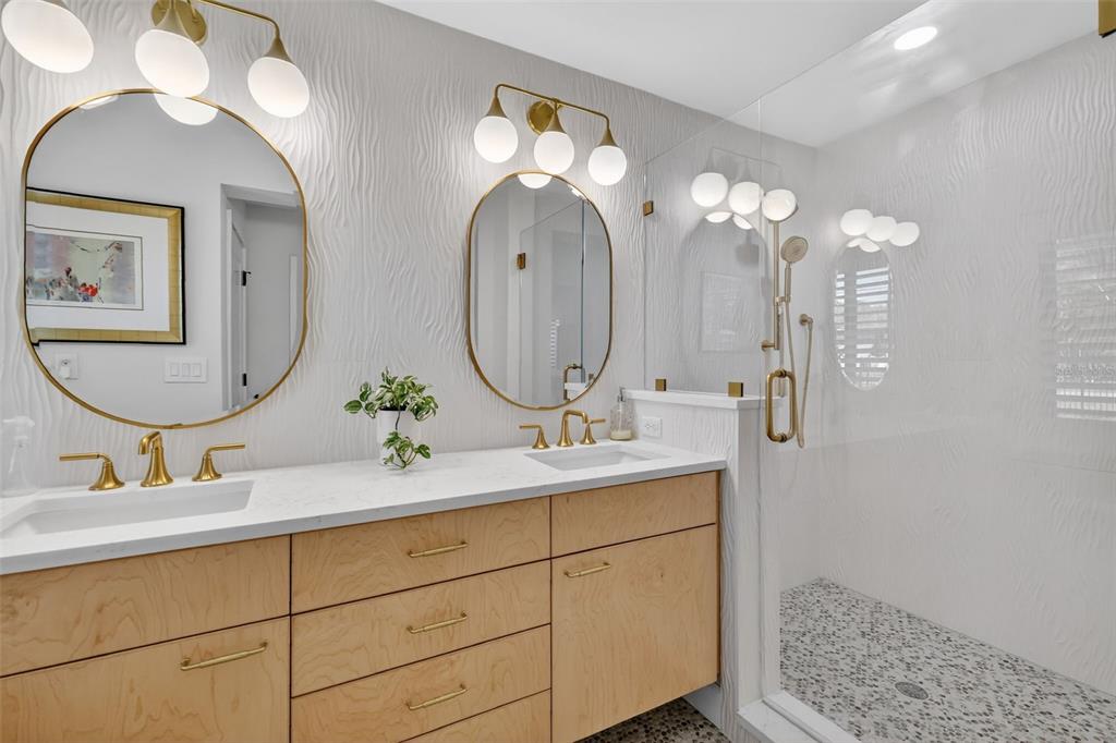 241 Bay Road Mount Dora, FL 32757 - Photo 30 of 57 a bathroom with a double vanity sink and a mirror