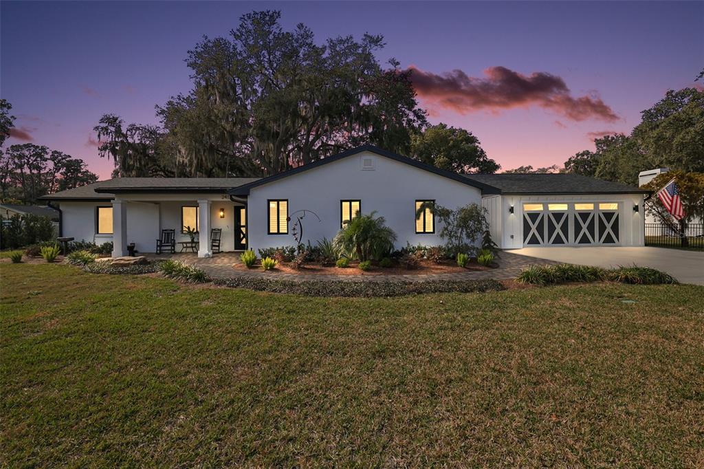 241 Bay Road Mount Dora, FL 32757 - Photo 3 of 57 a view of house with outdoor space and yard