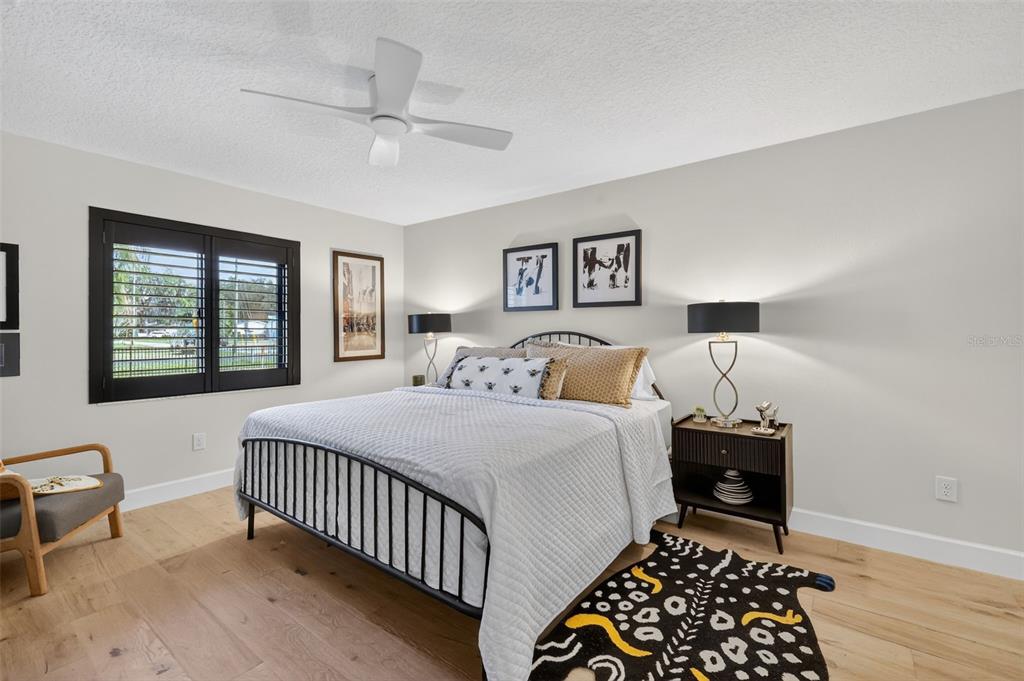 241 Bay Road Mount Dora, FL 32757 - Photo 31 of 57 a bedroom with a bed and a window