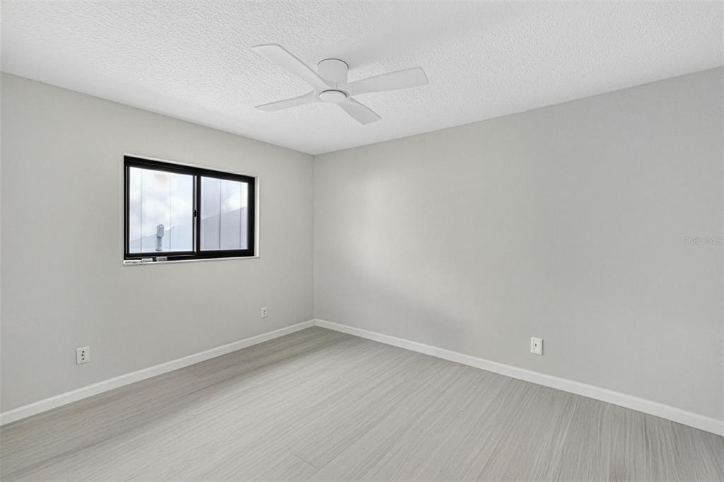 241 Bay Road Mount Dora, FL 32757 - Photo 33 of 57 wooden floor in an empty room with a window