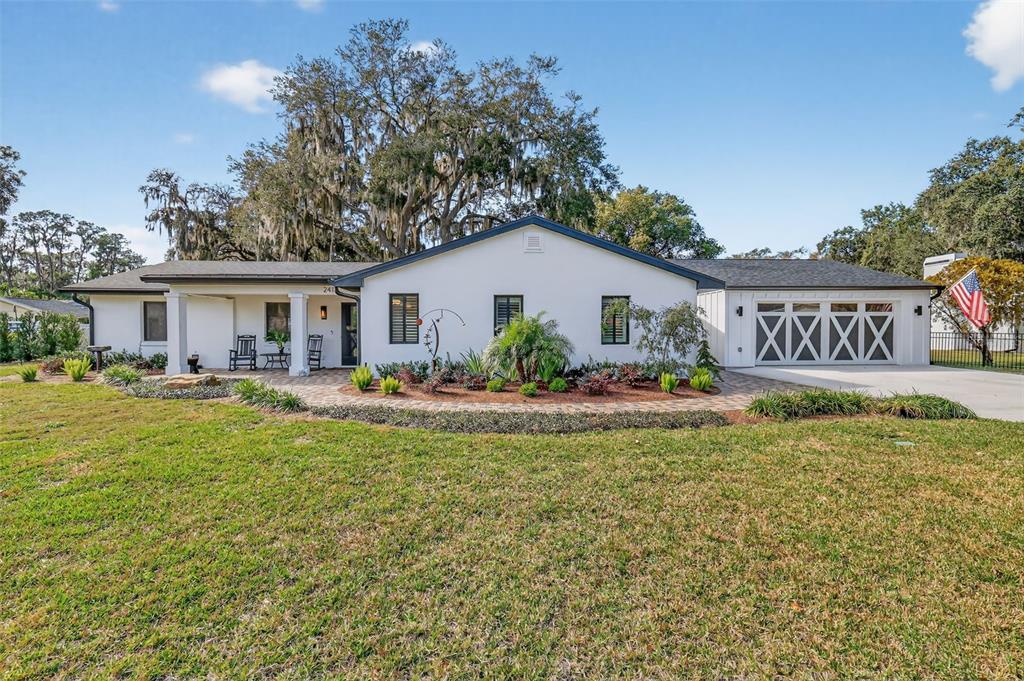 241 Bay Road Mount Dora, FL 32757 - Photo 4 of 57 a view of a house with pool and chairs