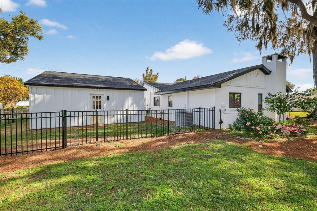 241 Bay Road Mount Dora, FL 32757 - Photo 43 of 57 a view of backyard with a garden and deck