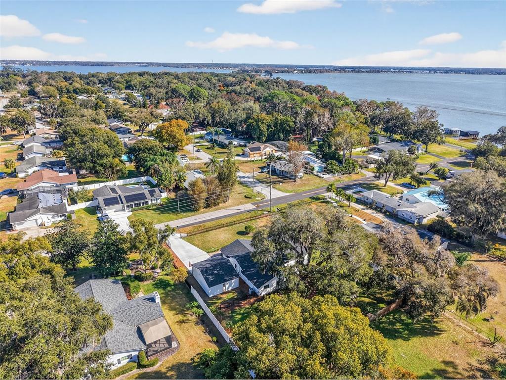 241 Bay Road Mount Dora, FL 32757 - Photo 53 of 57 an aerial view of residential houses with outdoor space