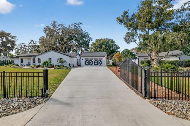 a view of a house with wooden fence