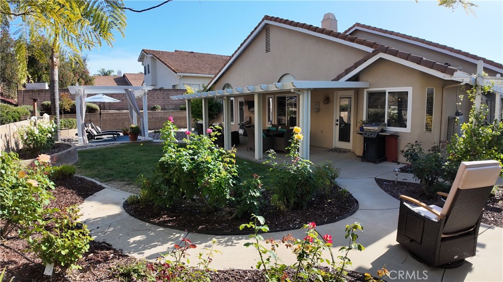 43080 Vista Del Rancho Temecula, CA 92592 - Photo 11 of 57 a view of a house with backyard sitting area and garden