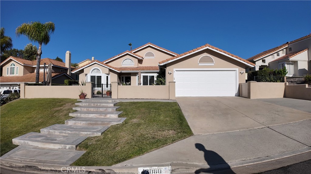 43080 Vista Del Rancho Temecula, CA 92592 - Photo 2 of 57 a front view of a house with a yard and garage