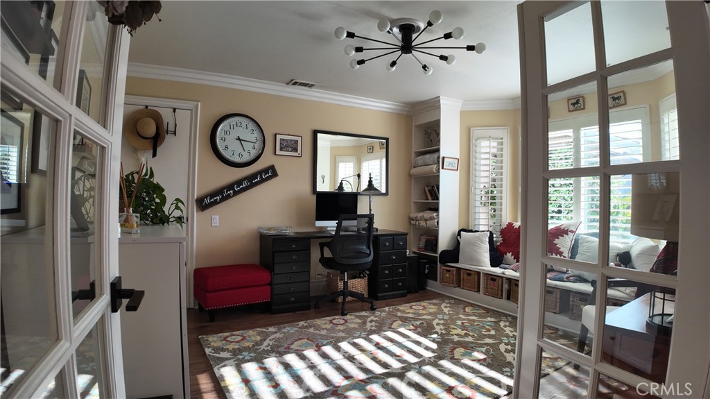 43080 Vista Del Rancho Temecula, CA 92592 - Photo 23 of 57 a living room with furniture a flat screen tv and a window