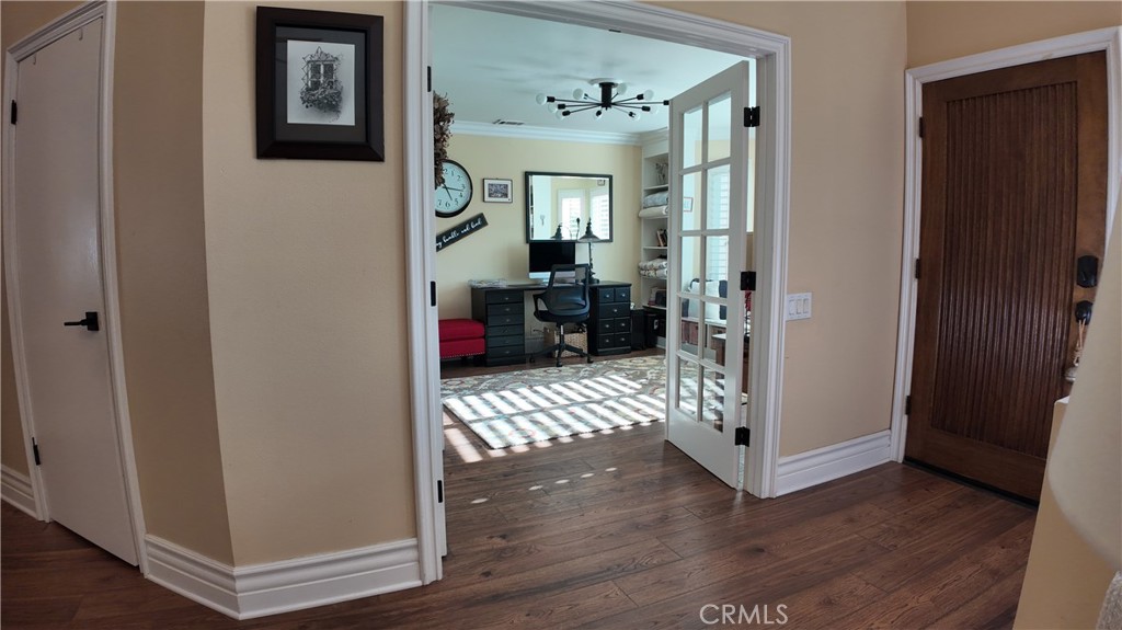 43080 Vista Del Rancho Temecula, CA 92592 - Photo 24 of 57 a view of a hallway with wooden floor and furniture