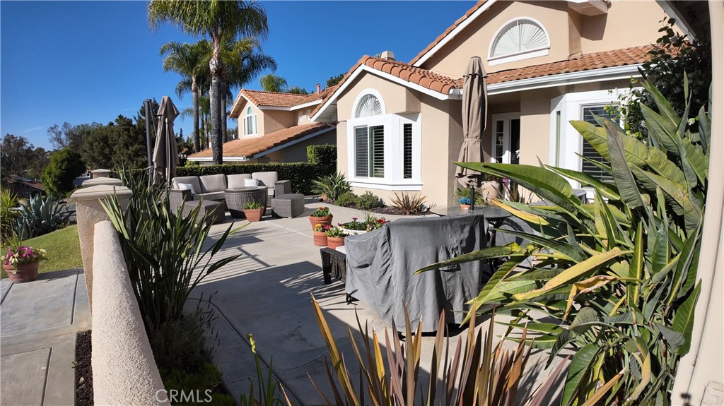 43080 Vista Del Rancho Temecula, CA 92592 - Photo 3 of 57 a view of a white house with large trees and plants