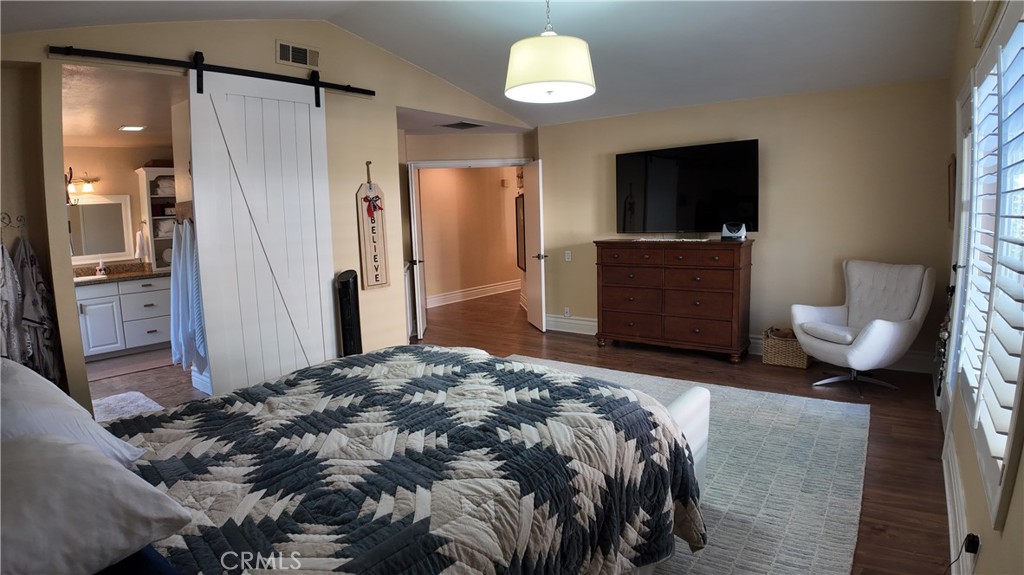 43080 Vista Del Rancho Temecula, CA 92592 - Photo 37 of 57 a bedroom with a bed and a flat screen tv