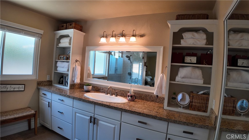 43080 Vista Del Rancho Temecula, CA 92592 - Photo 41 of 57 a bathroom with a sink and a mirror