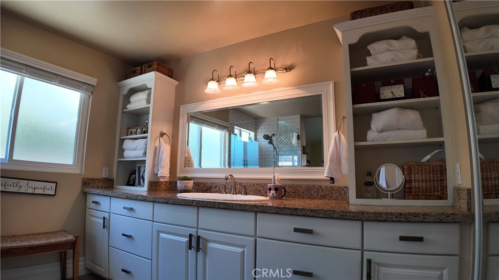 43080 Vista Del Rancho Temecula, CA 92592 - Photo 42 of 57 a bathroom with a sink and two mirror