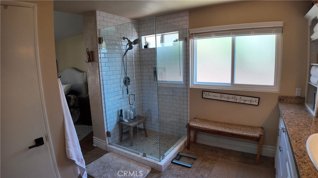 43080 Vista Del Rancho Temecula, CA 92592 - Photo 45 of 57 a bathroom with a sink a mirror and a shower