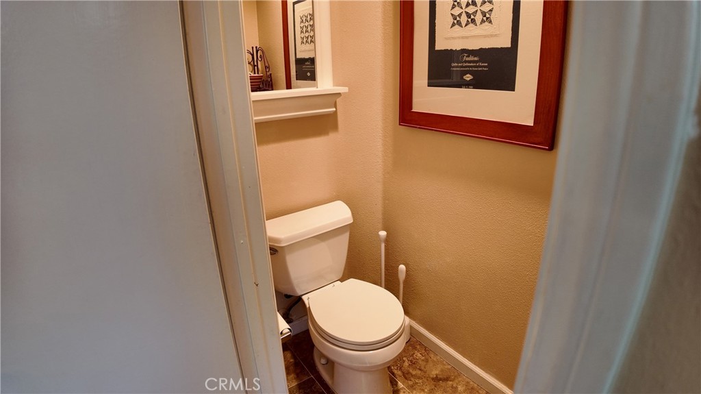 43080 Vista Del Rancho Temecula, CA 92592 - Photo 49 of 57 a white toilet sitting next to a small bathroom