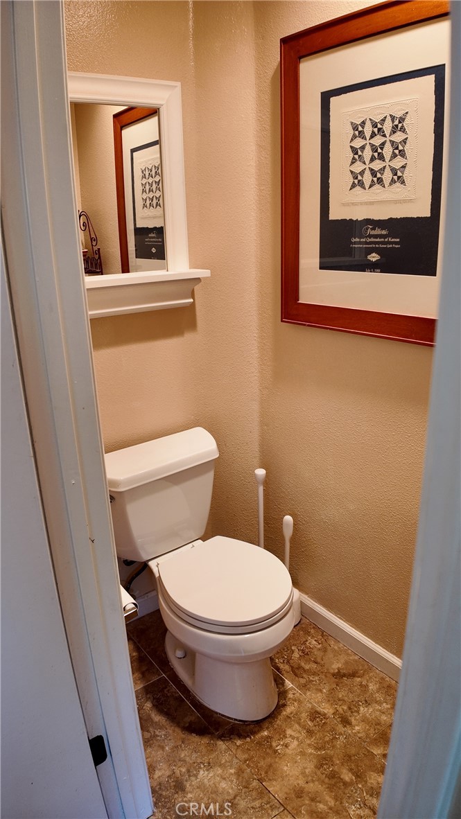 43080 Vista Del Rancho Temecula, CA 92592 - Photo 50 of 57 a white toilet sitting next to a small bathroom