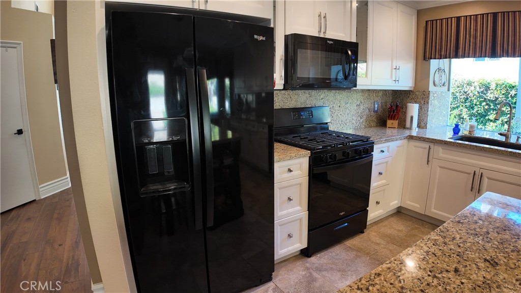 43080 Vista Del Rancho Temecula, CA 92592 - Photo 53 of 57 a kitchen with stainless steel appliances granite countertop a refrigerator a stove a sink and a microwave