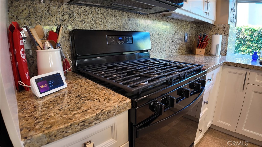 43080 Vista Del Rancho Temecula, CA 92592 - Photo 54 of 57 a stove top oven sitting inside of a kitchen