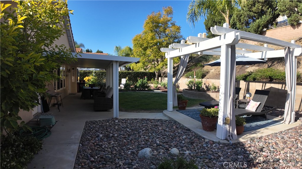 43080 Vista Del Rancho Temecula, CA 92592 - Photo 8 of 57 a view of a patio with table and chairs potted plants